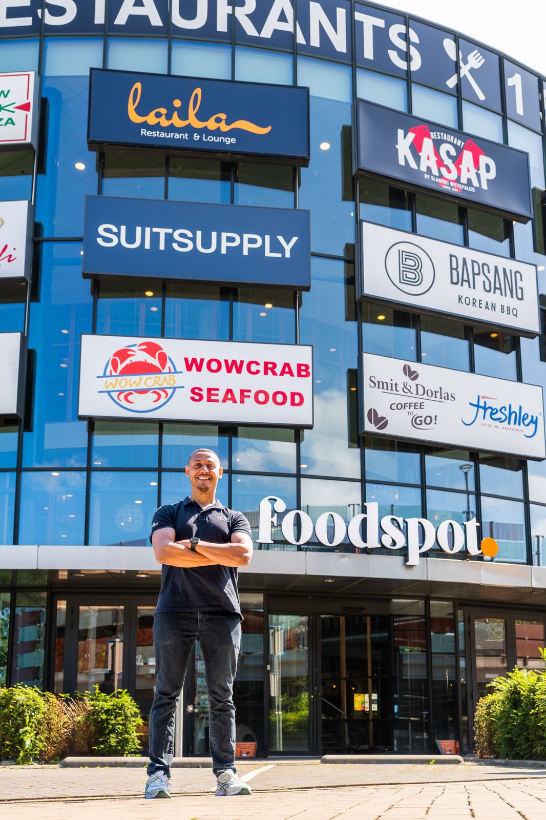 ICNT team member in front of the Foodspot venue, a multi-restaurant client site