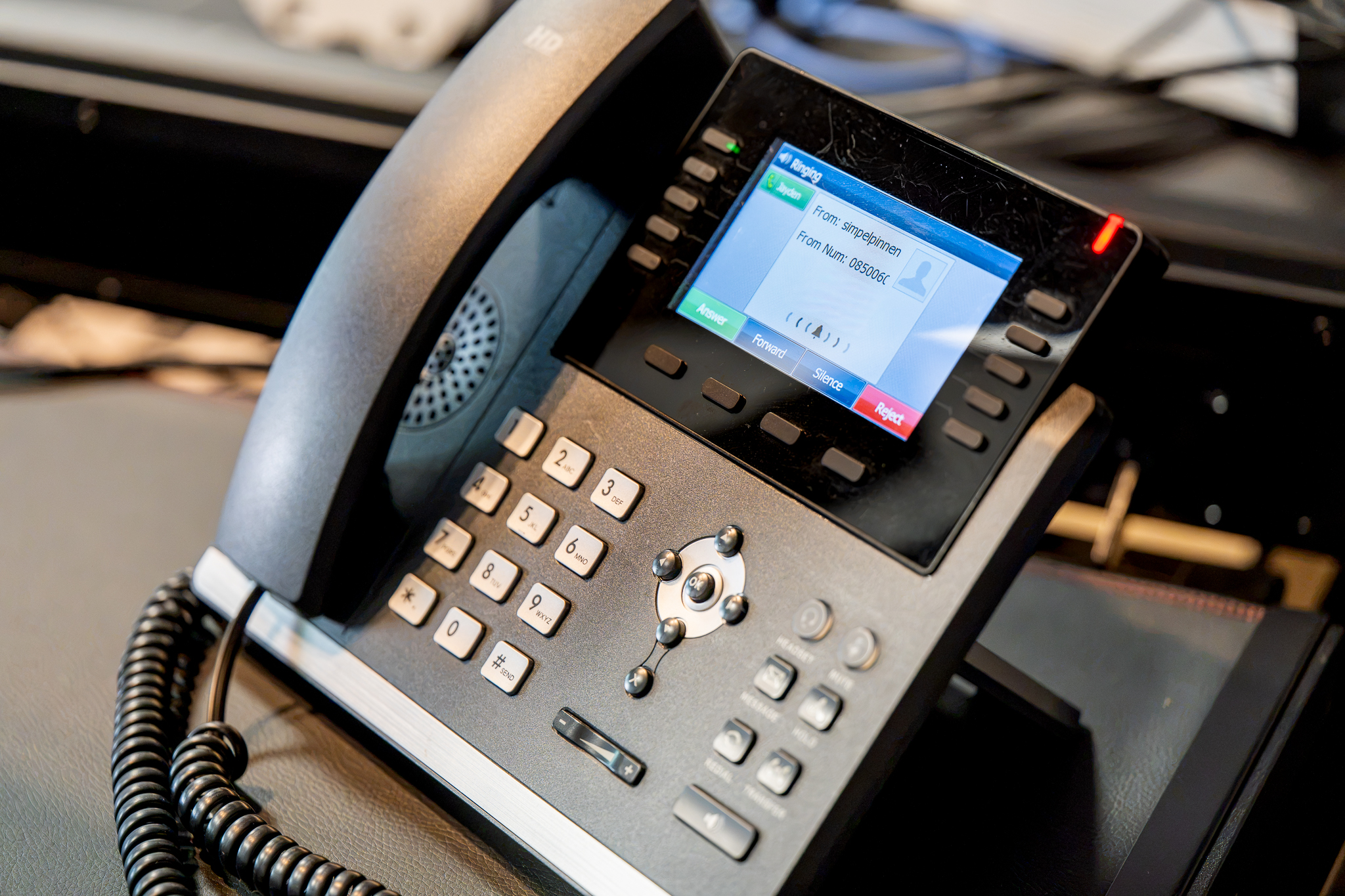 VoIP desk phone with a colour display set up by ICNT