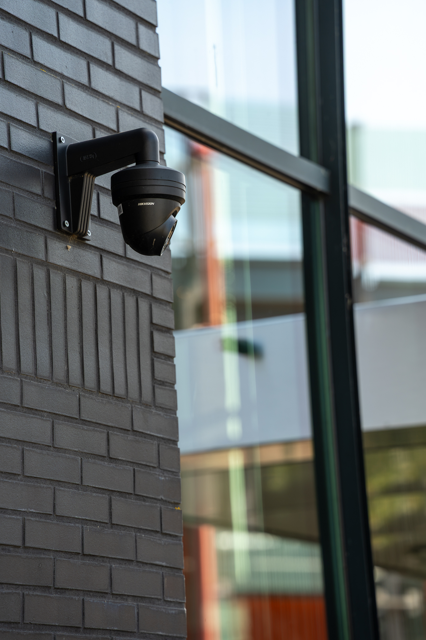 Dome security camera mounted on a commercial building