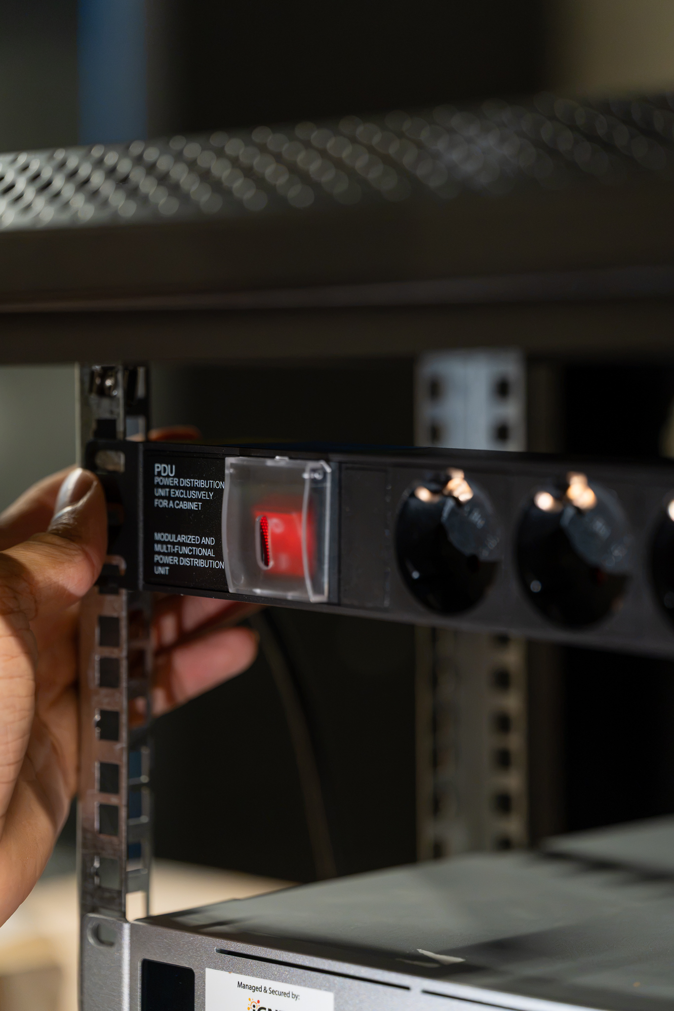 Power distribution unit in a rack at a business site