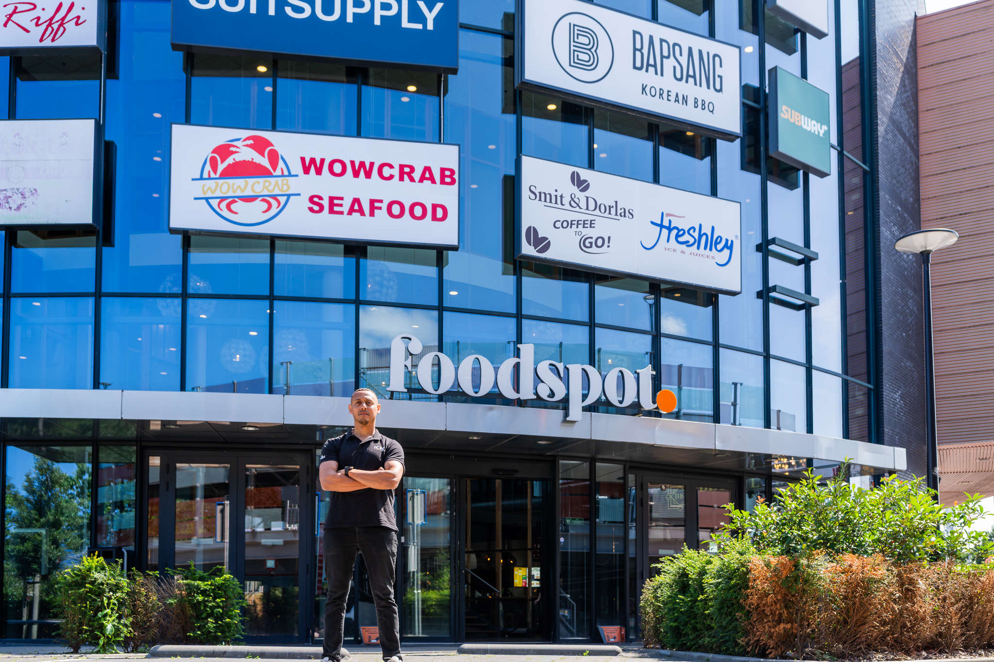 ICNT technician in front of the Foodspot venue, a multi-restaurant client site