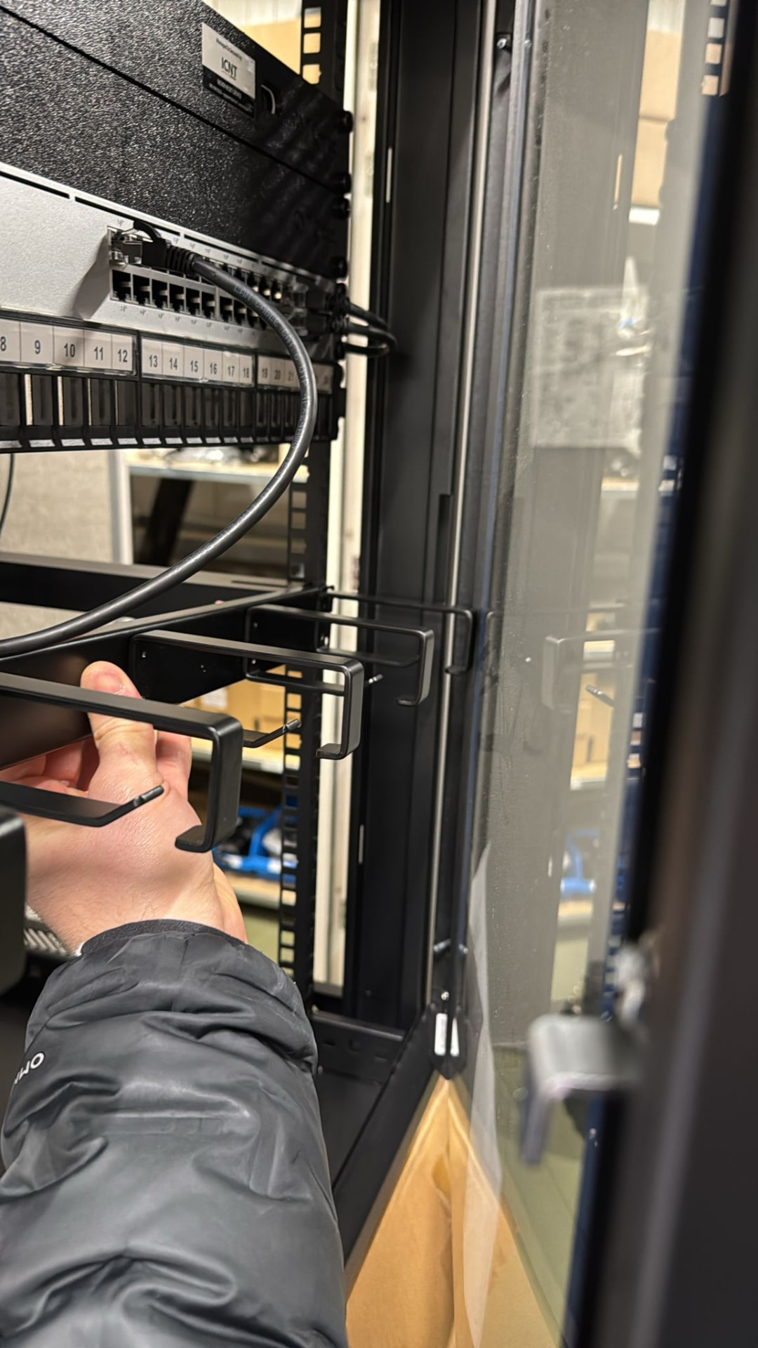 ICNT engineer working on a managed network server rack
